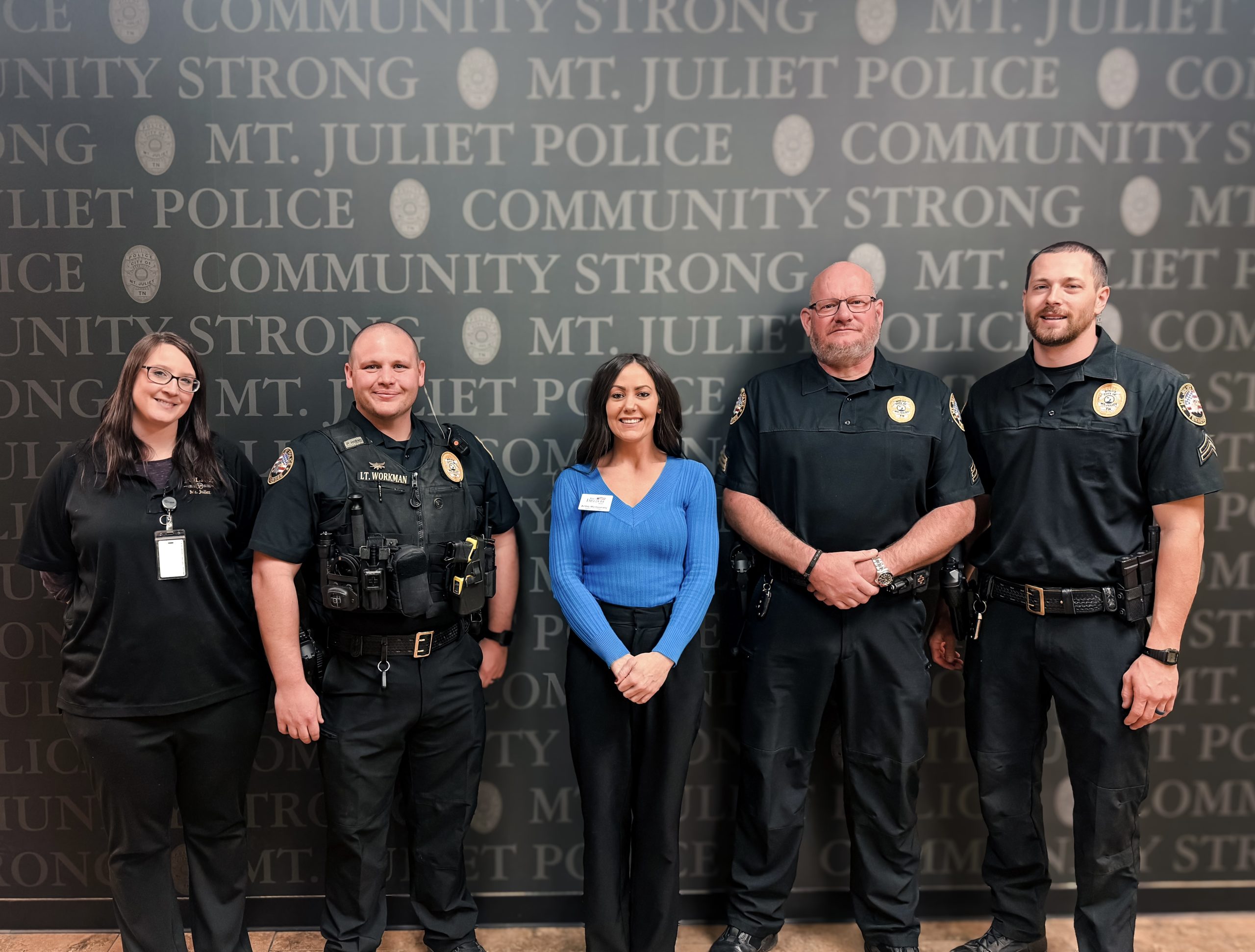 Ashley Montgomery standing with MJPD Officers at the training