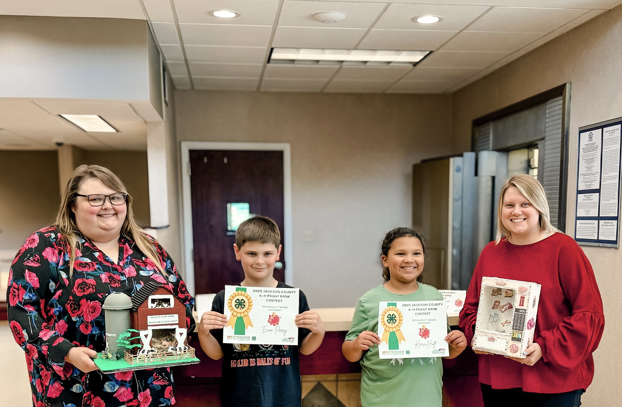 Bank Employees hold winning piggy banks while standing with contest winners.